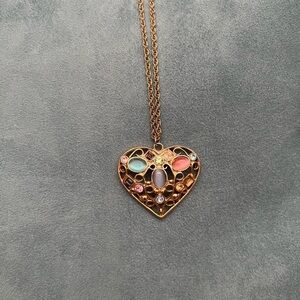 Ornate gold heart gemstone necklace